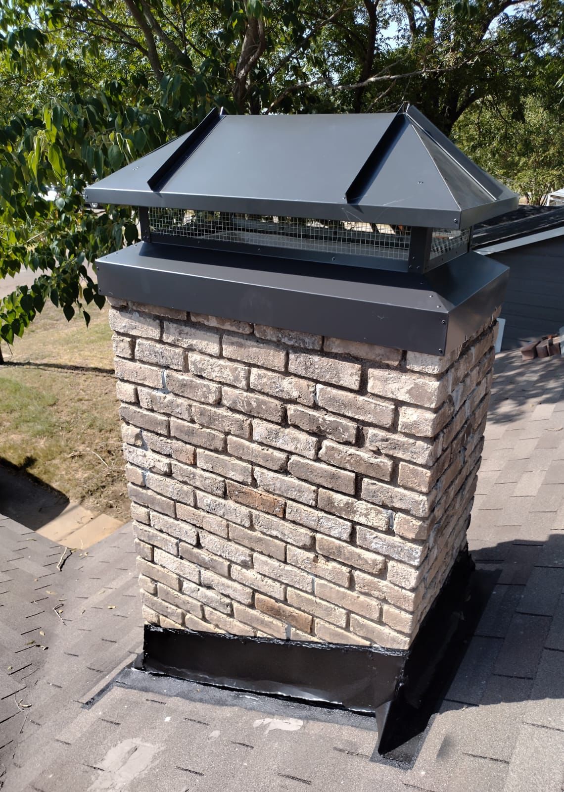 Chimney cap repair in Aurora Colorado.