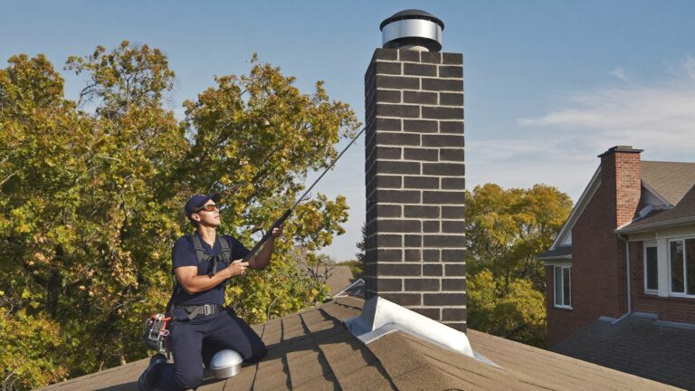 ALC Chimney Service technician performing a chimney sweep on a brick chimney in Keller, TX